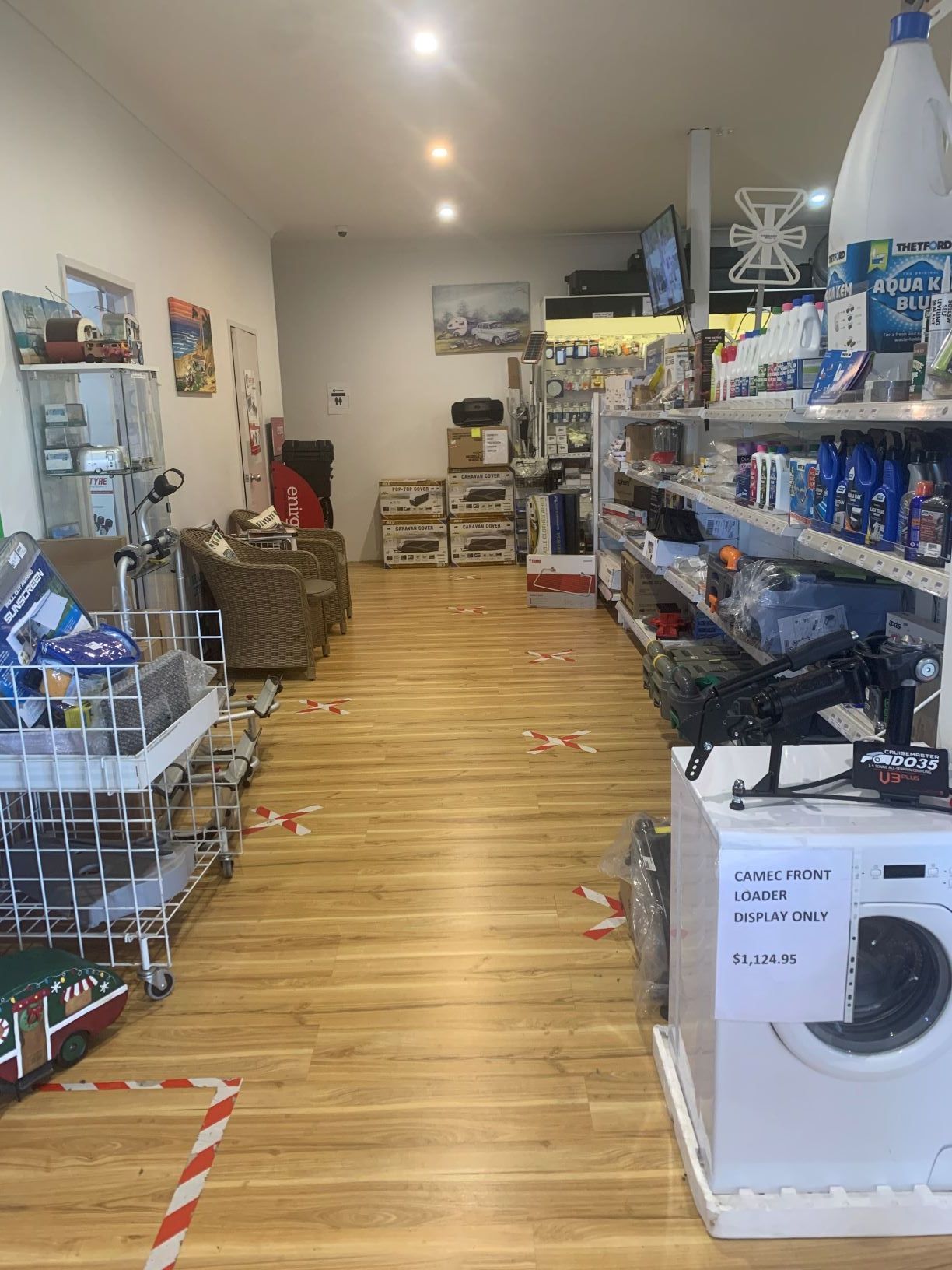 There is a washing machine in the middle of the room.