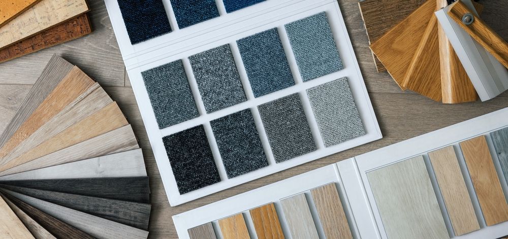 There are many different types of flooring and carpets on the table.