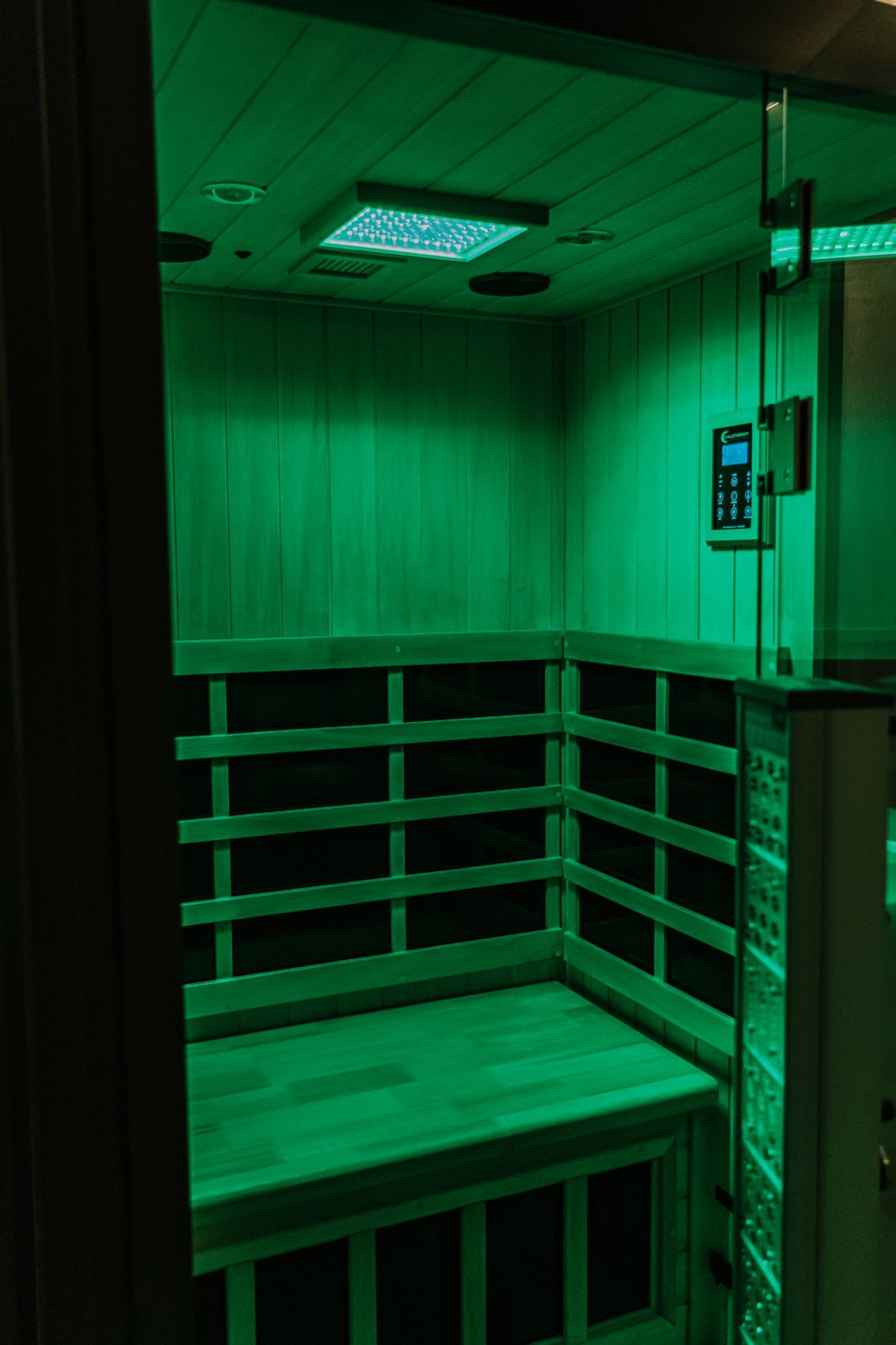 Red light therapy device inside a room, illuminating the space.