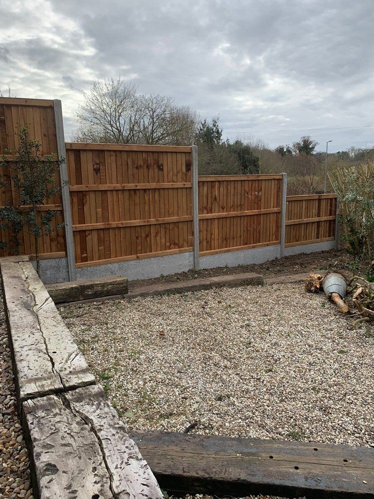 pebbled garden with fencing