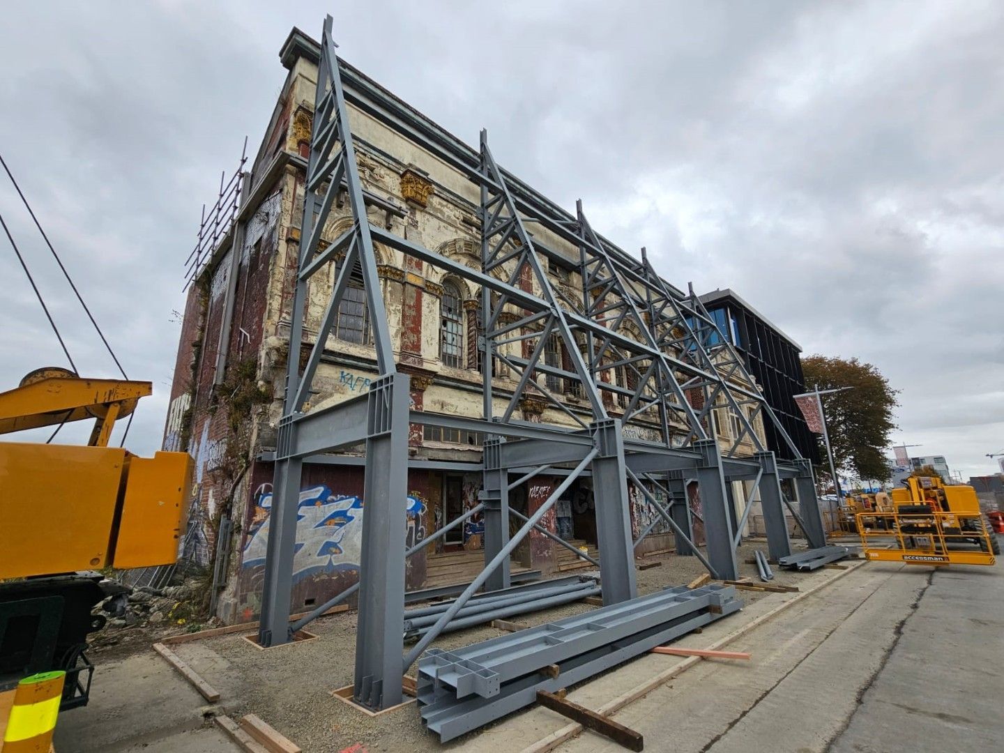 A large building is being built with a metal frame.