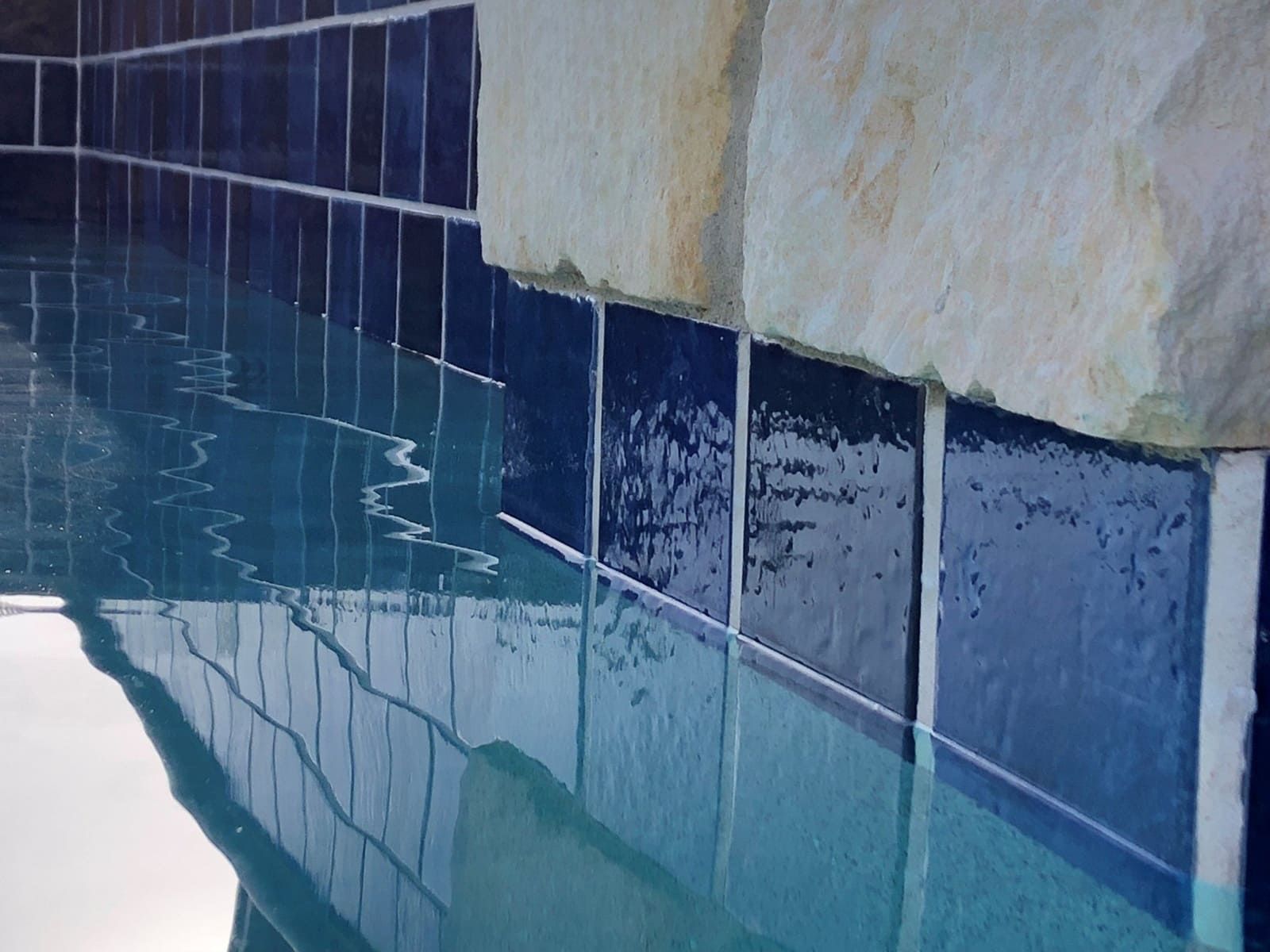 protect pool tiles from sun and chlorine