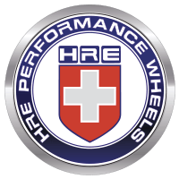 HRE Performance Wheels logo with red shield and white cross in a silver circular badge
