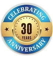 Celebrating 30th Anniversary badge: blue, gold, and brown colors.  