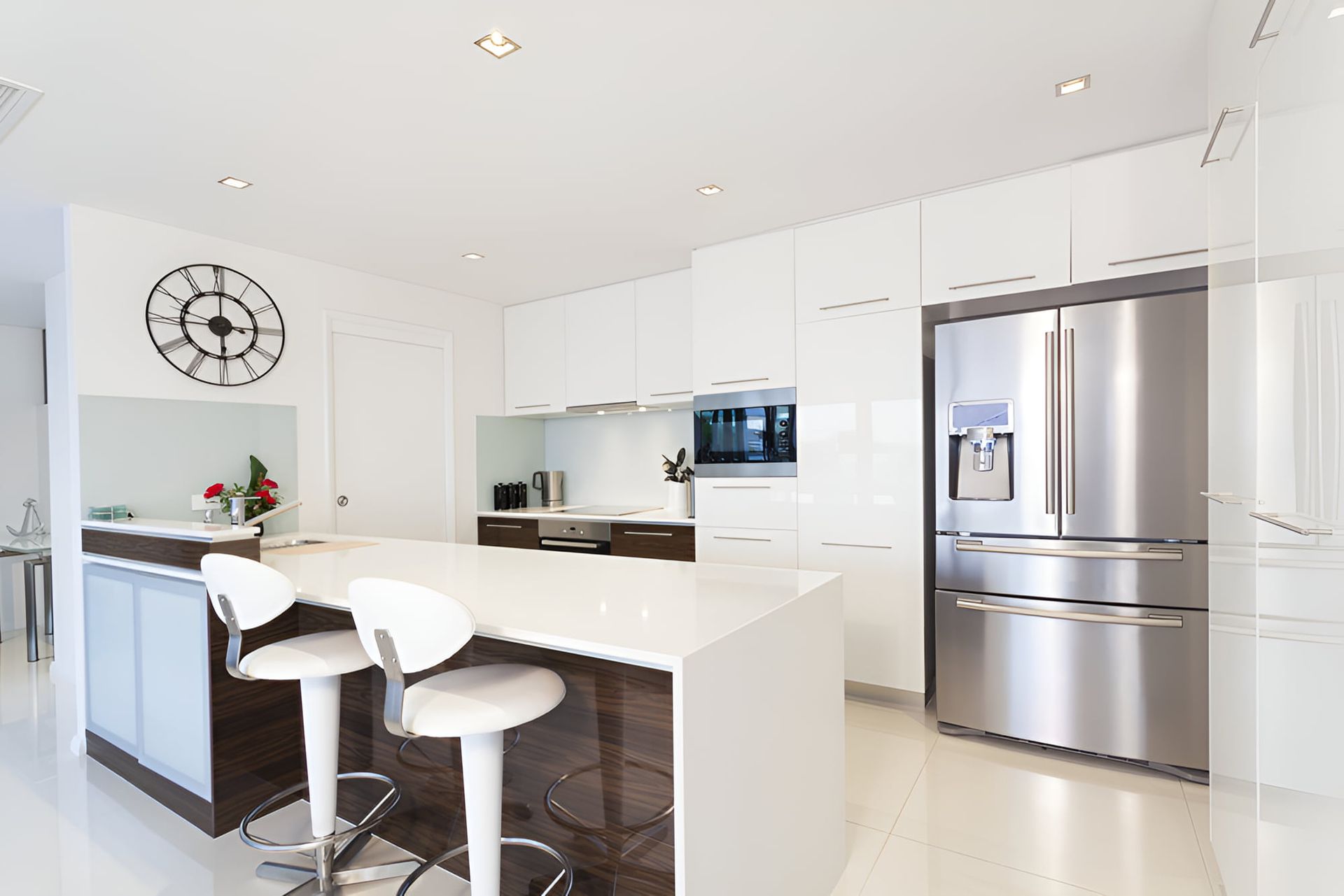 A Kitchen With Stainless Steel Appliances And White Cabinets — McGrath Builders & Associates In Yarrawonga, VIC