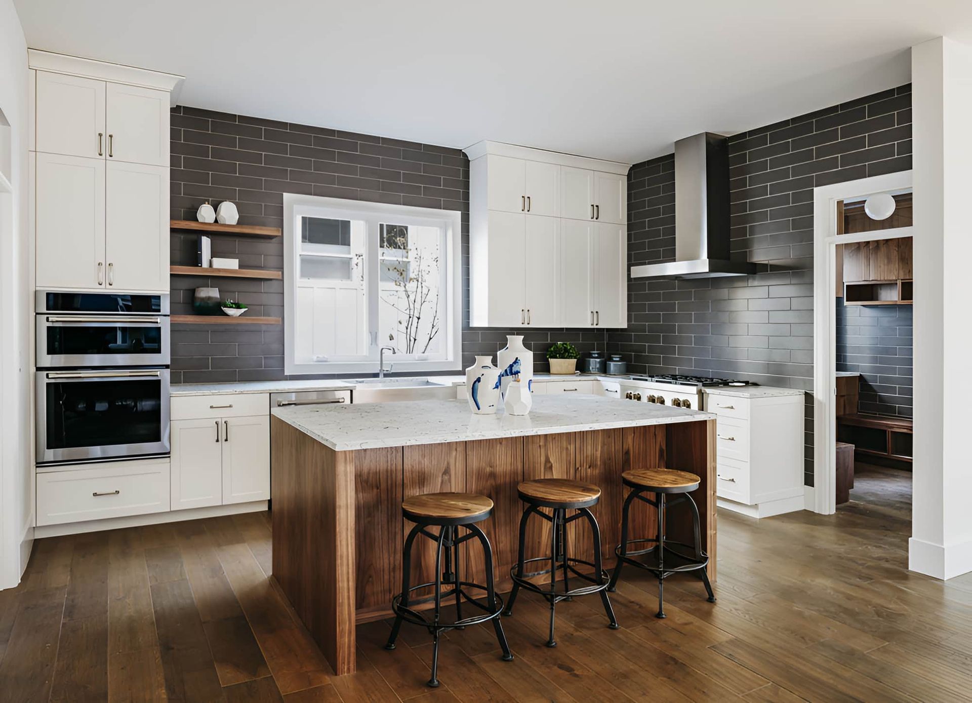 A Kitchen With White Cabinets , Stainless Steel Appliances — McGrath Builders & Associates In Lavington, NSW