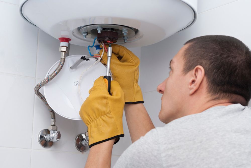 Man Checking Electric Broiler in The Bathroom