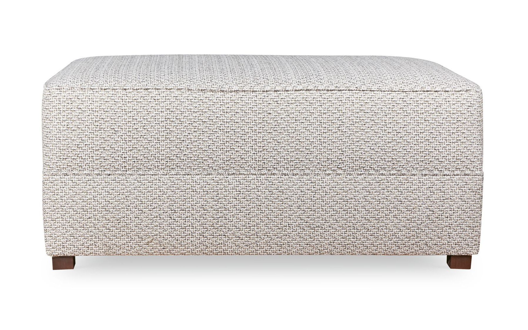 A white ottoman with a pattern on it is on a white background.