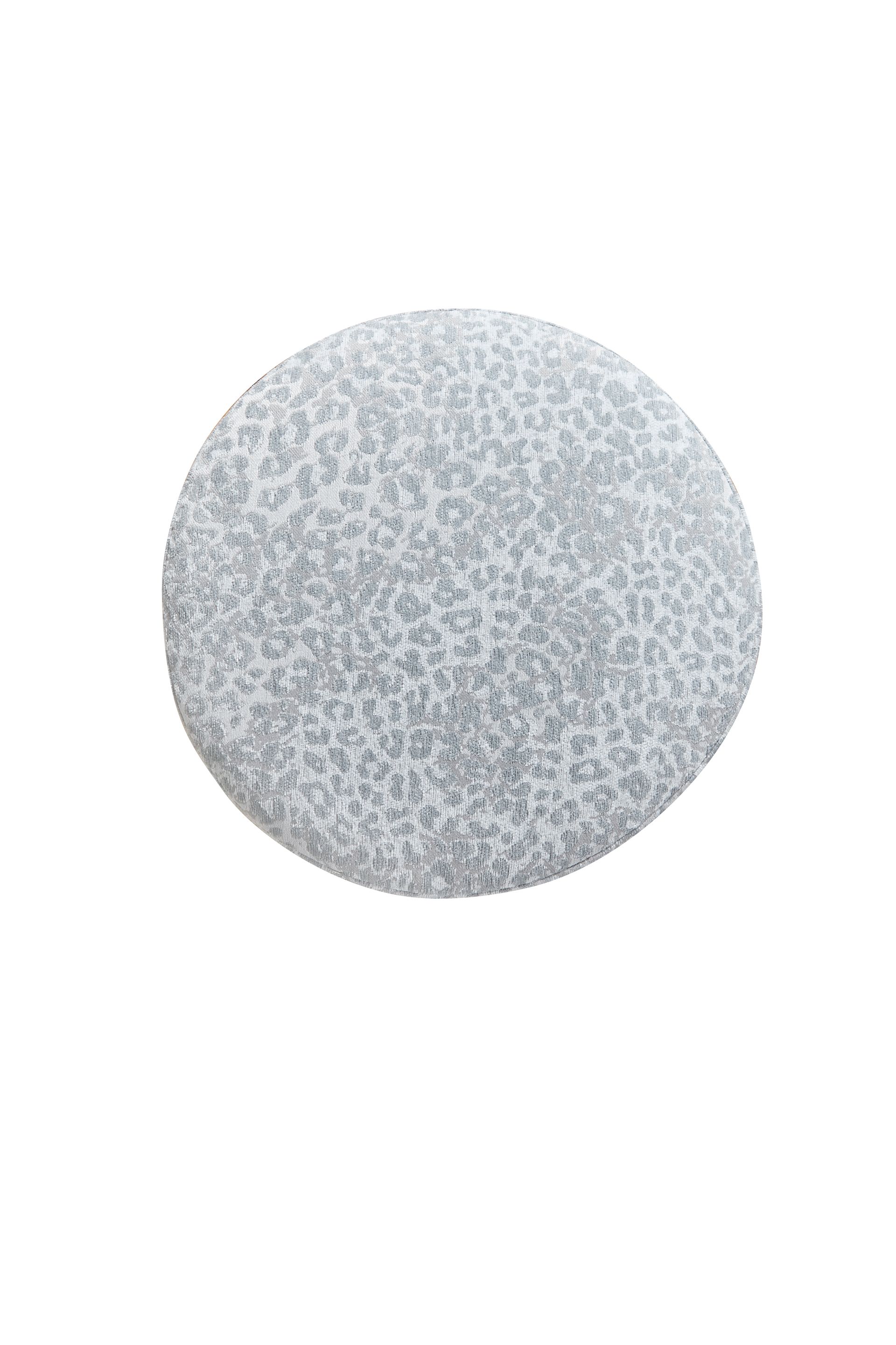A close up of a round rock on a white background.