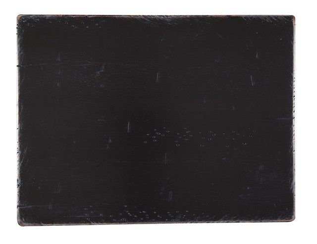 Black rectangular object on white background.