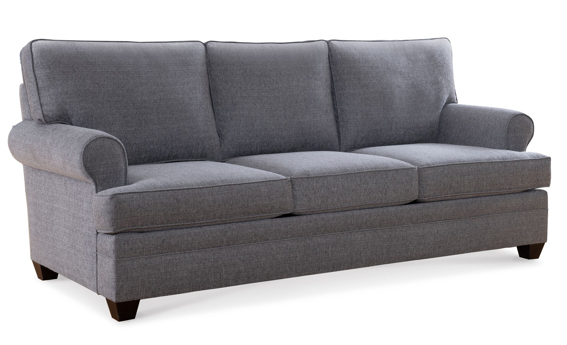A grey couch is sitting on a white background