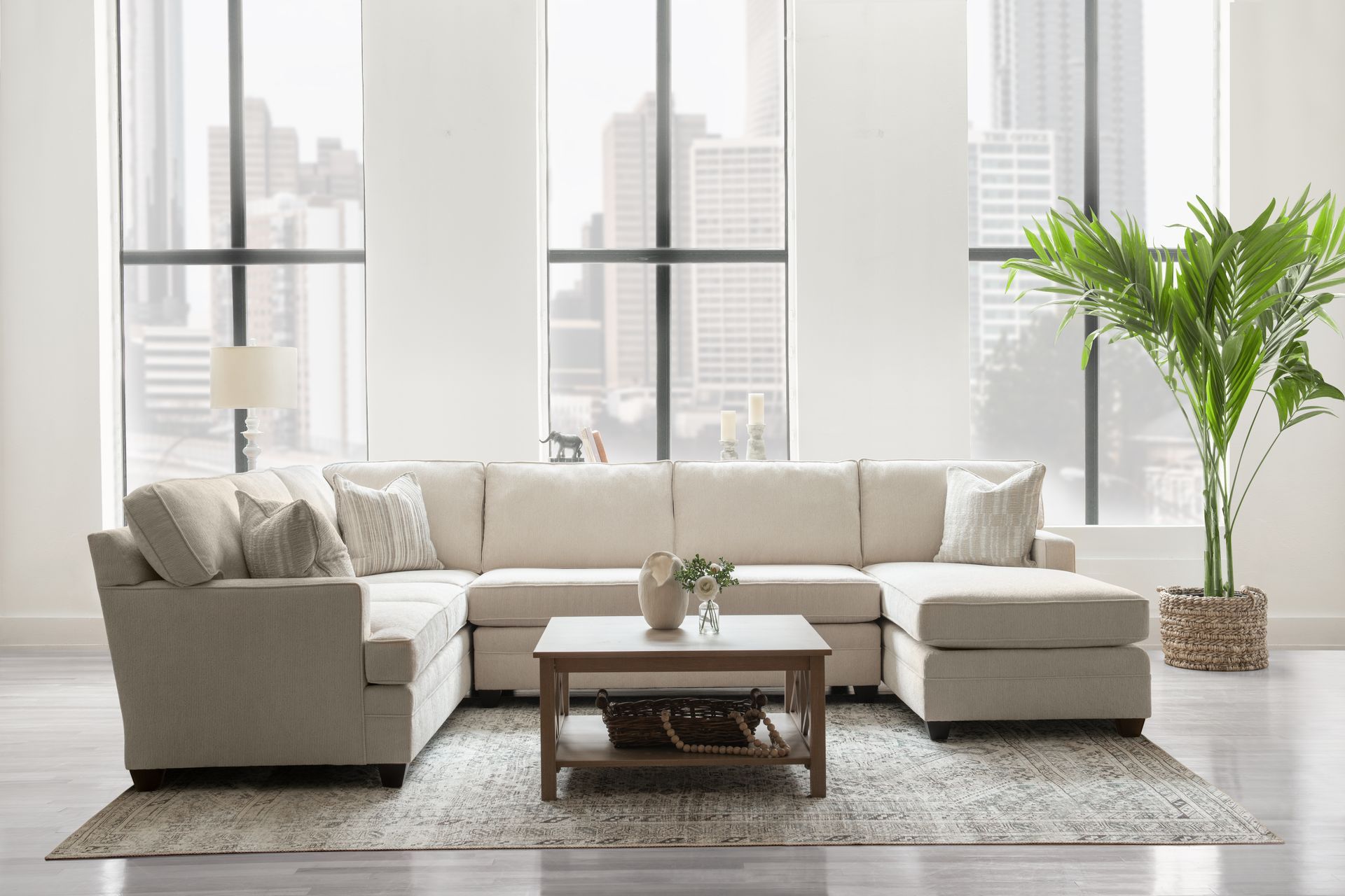 A living room with a sectional couch and a coffee table.