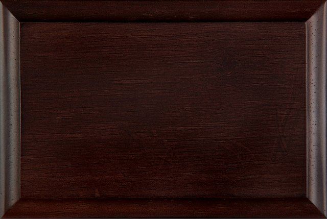 Dark brown wooden cabinet door with a raised panel.