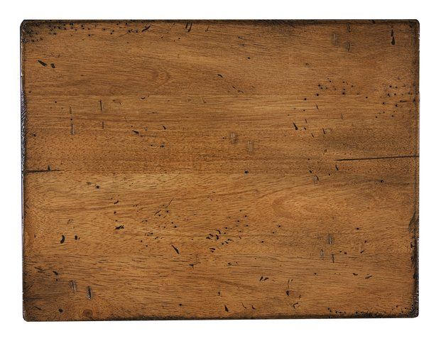Wooden tabletop with wood grain and dark edging.