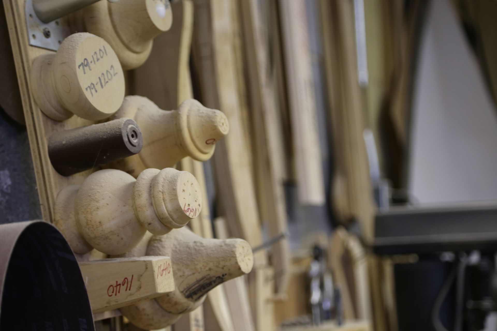 A bunch of wooden pieces are stacked on top of each other on a rack.