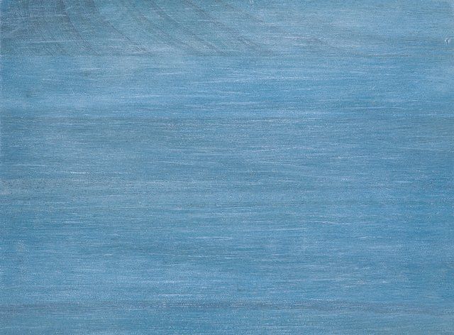 Blue textured background. Horizontal streaks of lighter blue create a wood-grain effect.