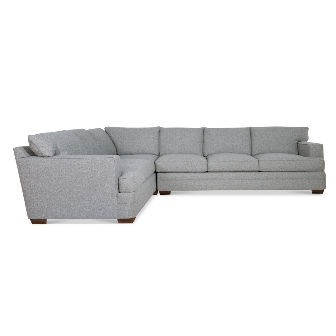 Gray sectional sofa with four back cushions and a chaise.