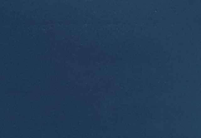 Solid, dark blue background.