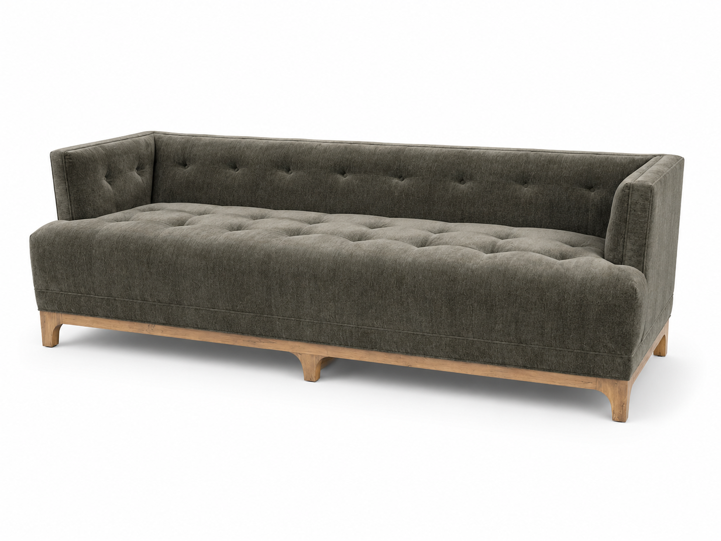 Dark green tufted sofa with wooden legs on a white background