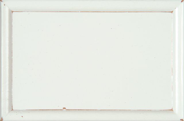 White, rectangular wooden cabinet door with a framed, recessed panel.