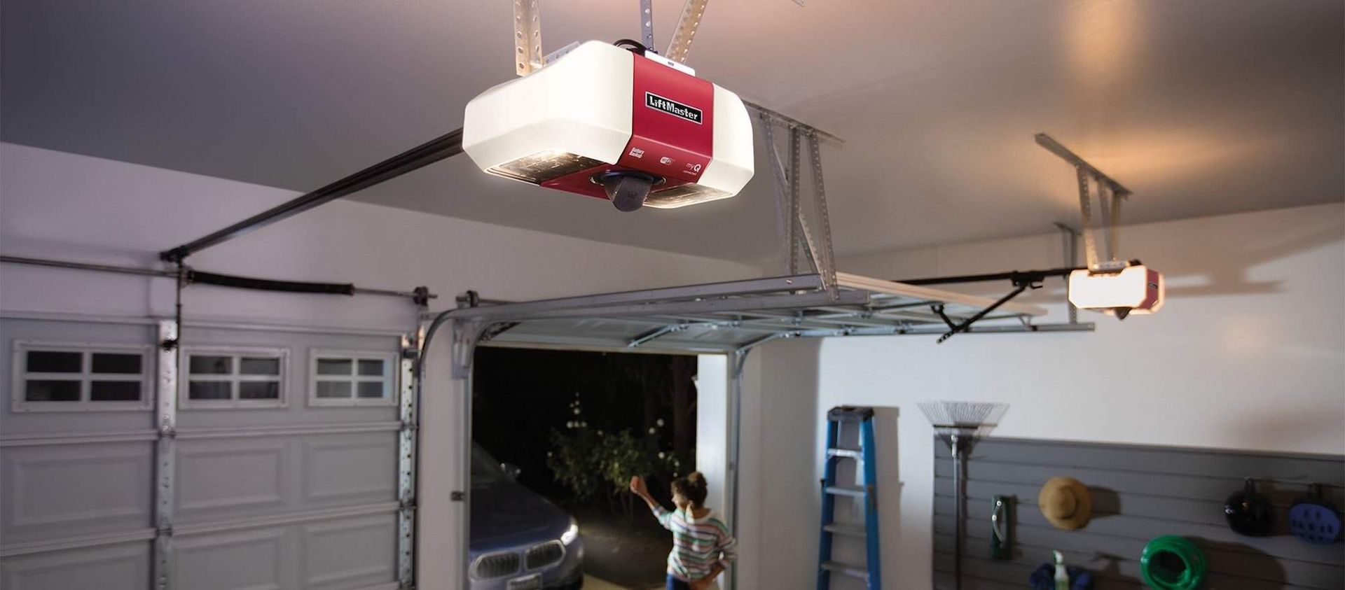 Garage interior with an open garage door and garage door opener.