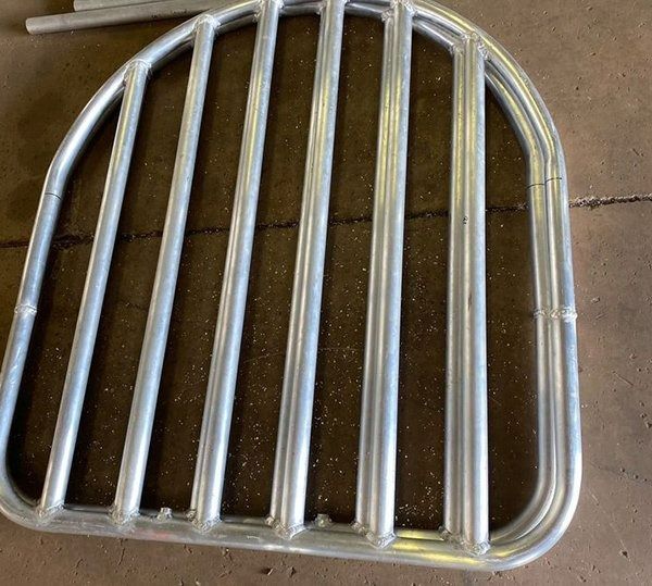 Metal Arch-shaped Livestock Feeder With Vertical Bars — Greville Fabrication in Girraween, NSW