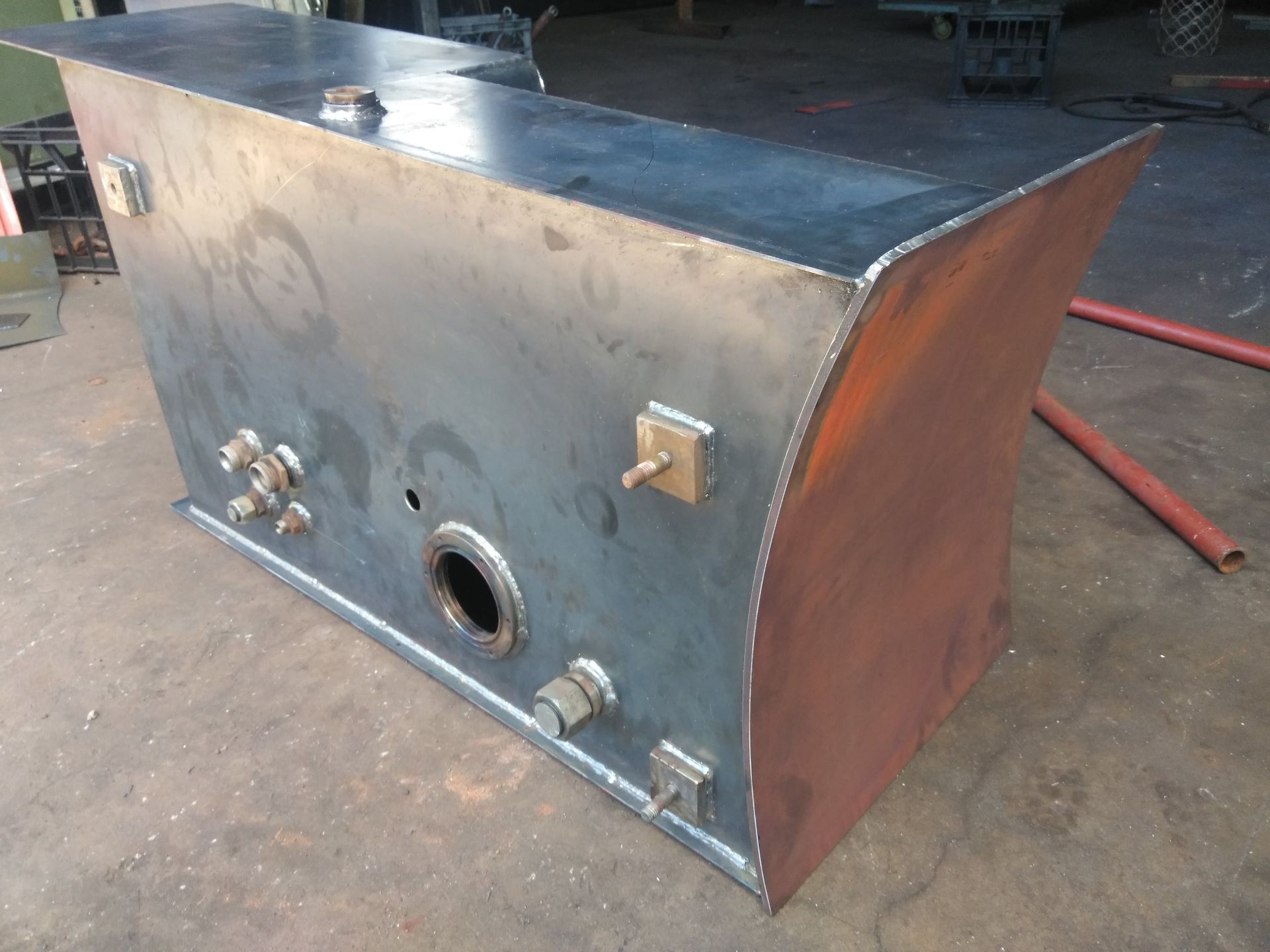 Metal Industrial Tank or Heater With a Curved Rust-colored End, Shown Outdoors — Greville Fabrication in Girraween, NSW