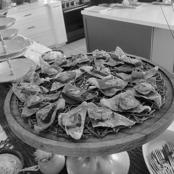 A black and white photo of food on a table