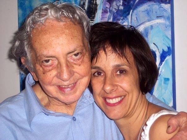 A man and a woman are posing for a picture together