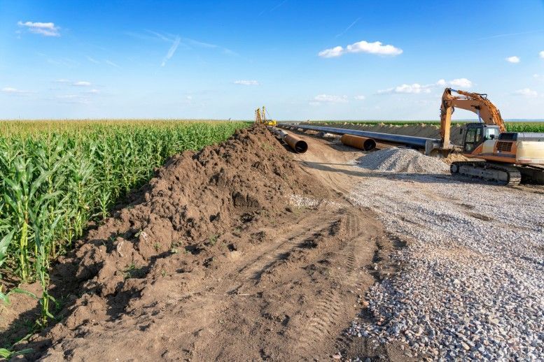 A Large Pile of Dirt is Sitting on the Side of a Road — Payton Civil Products in Wilsonton, QLD