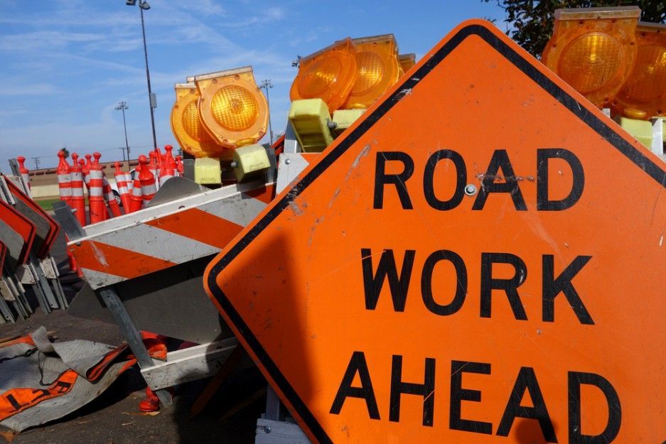An Orange Sign That Says Road Work Ahead on It — Payton Civil Products in Warwick, QLD