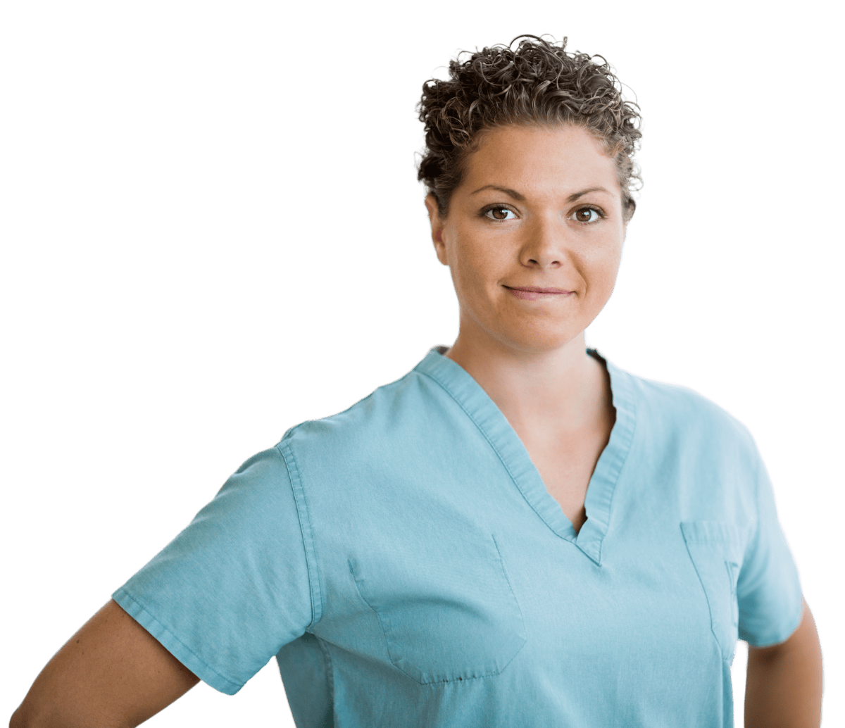 A person with short, curly hair wears a light blue V-neck medical scrub top against a plain white background.