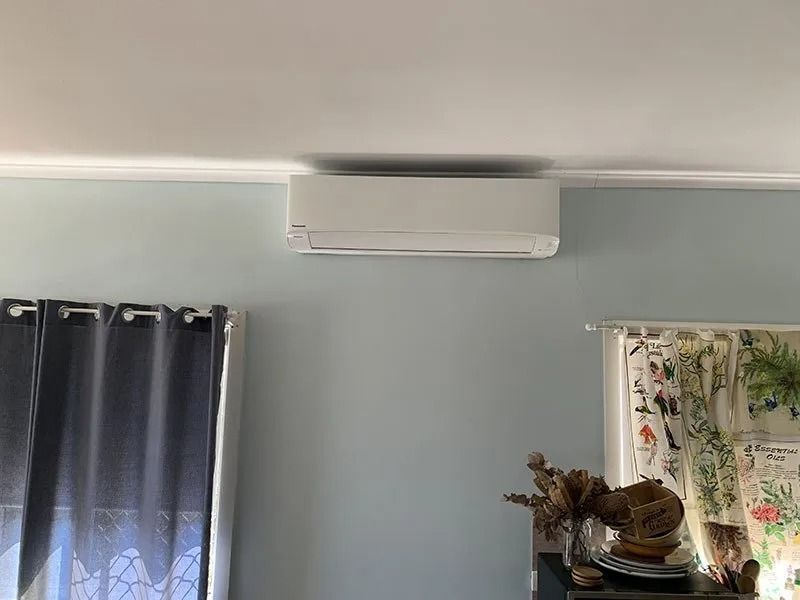 A Room With a Window, Curtains and a Ceiling Fan — Northside Air Conditioning Services In Aspley, QLD
