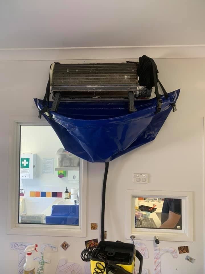 A Blue Bag is Hanging From the Ceiling of a Room — Northside Air Conditioning Services In Ascot, QLD