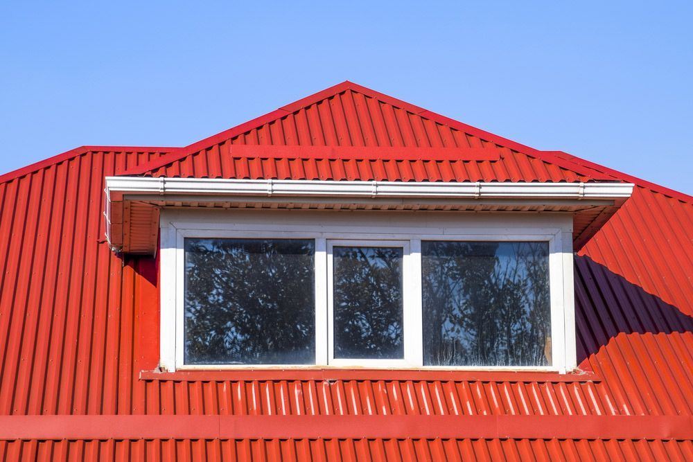 House With Red Metal Roofing — Experienced Roofer in Rangeville, QLD
