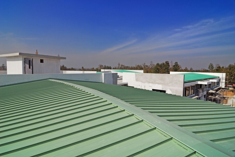 Green Metal Roof On Residential House — Experienced Roofer in Brisbane, QLD