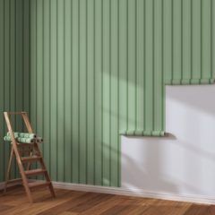 Green vertical paneling wall, being worked on. A ladder and a roll of wallpaper are present.