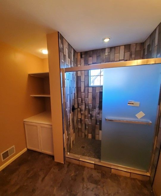 Bathroom remodel with Schluter waterproofing system and hex tile shower floor