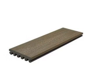 A piece of wood is sitting on top of a white surface.