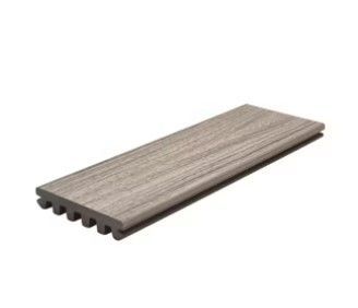 A piece of wood is sitting on top of a white surface.