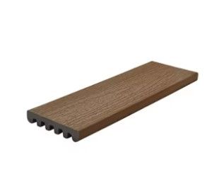 A piece of wood is sitting on top of a white surface.