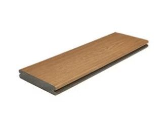 A wooden plank is sitting on top of a white surface.