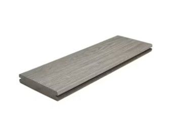 A piece of wood is sitting on top of a white surface.
