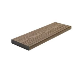 A wooden plank is sitting on a white surface.