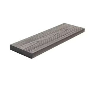 A wooden plank is sitting on top of a white surface.