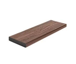 A wooden plank is sitting on top of a white surface.