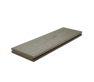 A piece of wood is sitting on a white surface.