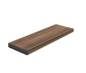 A wooden plank is sitting on a white surface.