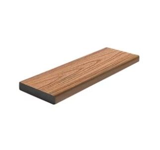 A wooden plank is sitting on top of a white surface.