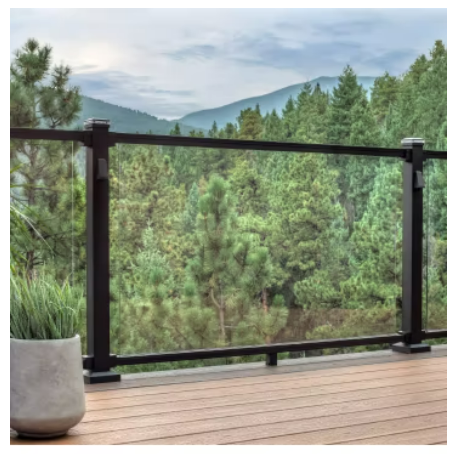 A balcony with a view of a forest and mountains